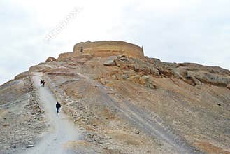 Tourists walking around Zoroastrian Towers of Silence, YAZD, IRAN