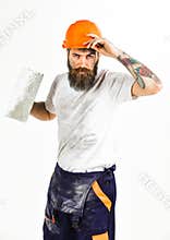 Bearded repairman with serious face and dirty boilersuit, white background.