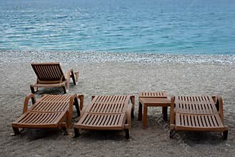 Empty sun beds by the Mediterranean sea.