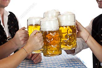 Bavarian group toast with Oktoberfest beer stein