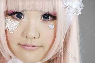 Portrait of japanese cosplayer wearing pink dress