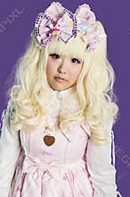 Portrait of japanese cosplayer wearing pink dress