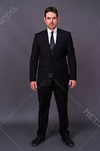 Portrait of handsome bearded businessman in suit