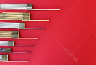 Antique folding rulers aligned on left margin as finance or trends chart: measurement, precision, metrics