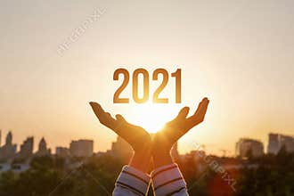 Show New Year 2021 against the background of the sun