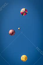 Looking Up In a Blue Sky With Hot Air Balloons