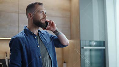 Handsome Man Speaks By Phone and Eats Berries.