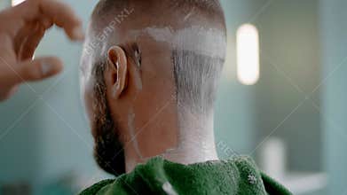 Hairdresser Delicately Shaves the Back of the Customer Head.