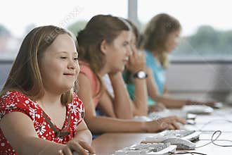 Children (10-12) using computer in computer lab
