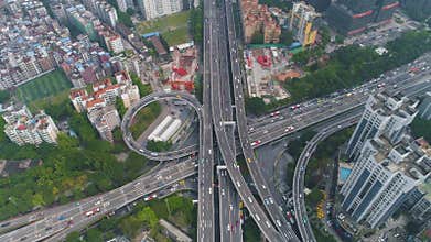 Guangzhou city and complex road interchange. Guangdong, China. Aerial view