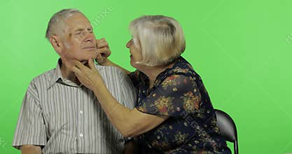 Funny senior aged man and woman sitting together. Concept of a happy old family