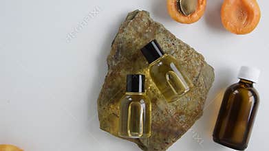Bottles with apricot essential oil. Natural cosmetic treatment products
