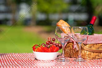 Picnic. bottle of wine with glasses. strawberry.romance. rest and sunny mood