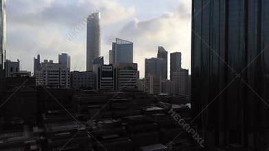 Magical time lapse of city skyscraper at a cloudy sunset - Abu Dhabi skyline, United Arab Emirates