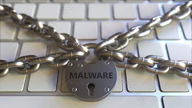 Chains and padlock with MALWARE text on the computer keyboard. Conceptual 3D animation