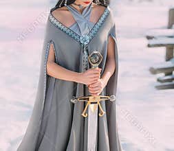 Bravery and power of dark elves in cold winter forests. young woman