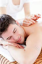 Charming young man in an acupuncture therapy