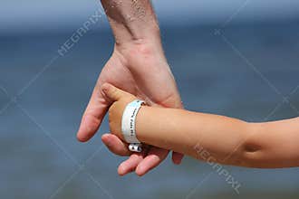 Baby with info wristband