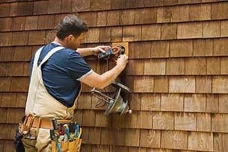 Electrician testing electrical current
