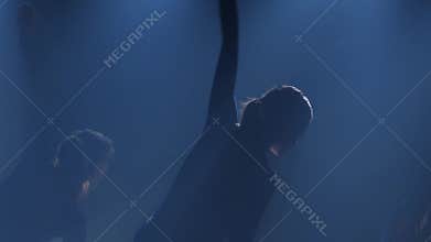 Slow motion of three ballerinas dancing elements of ballet. Close-up
