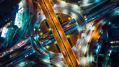Top view time-lapse of car traffic at circle roundabout, 4K UHD drone zoom out aerial shot. Advanced transport technology concept