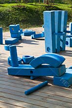 childrens playground in park with blue giant geometric figures f