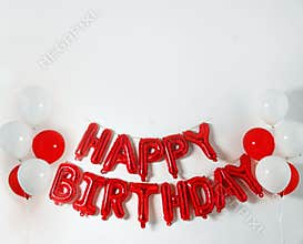 Phrase HAPPY BIRTHDAY made of color balloon letters on white background