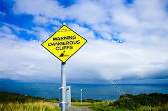warning sign for dangerous cliffs
