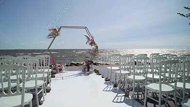 Wedding ceremony decorated with flowers. Marriage reception with bouquets. Beautiful party.