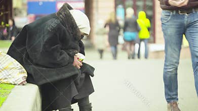 Beggar homeless woman. Poverty. Vagrancy. Kyiv. Ukraine.