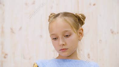 Portrait of beautiful upset little girl looking down