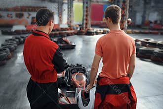 Two kart racers in equipment, karting auto sport