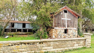 Wooden Barn with White Cross