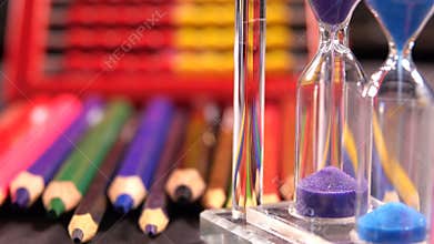 Sand watch and school supplies