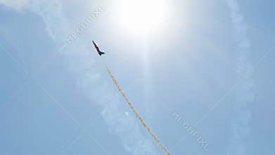 Su-35 aircraft is flying up to space as rocket breaking clouds to reach stars.