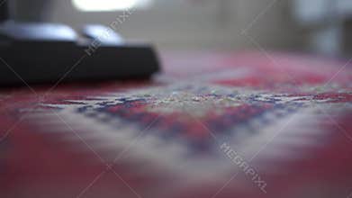 Housewife vacuuming carpet at home, slow motion