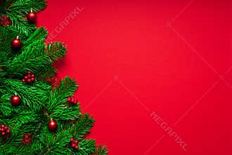 Red Merry Christmas Background with Fir branch an Baubles