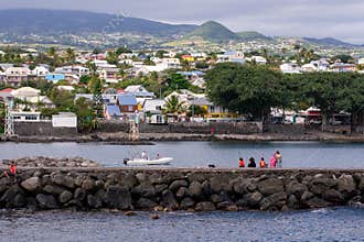 People fishing on a sunny day at Saint pierre Harbor on RÃ©union Island