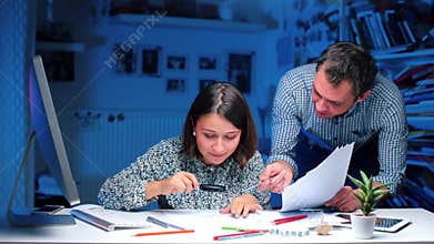 Bankers at the table analyze information, look at documents.