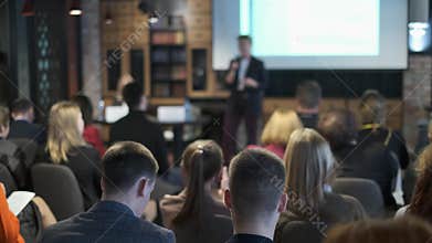 Audience listens lecturer at workshop