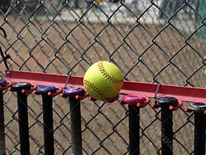 Yellow Softball and Bats