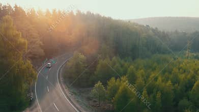 Electric car driving on a forest highway with technology assistant tracking information, showing details