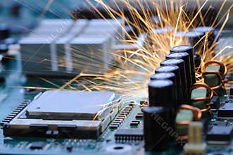 Burning sparks fly from a circuit chip