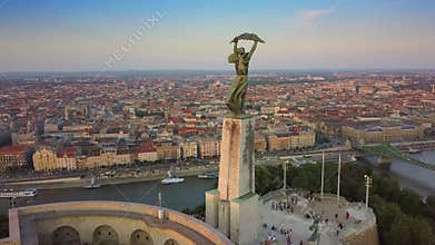 Budapest, Hungary - 4K orbiting around the Statue of Liberty on Gellert Hill at sunset