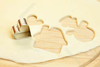 Cut dough snowman, house, heart