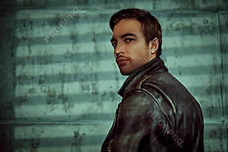 Brutal guy in leather jacket