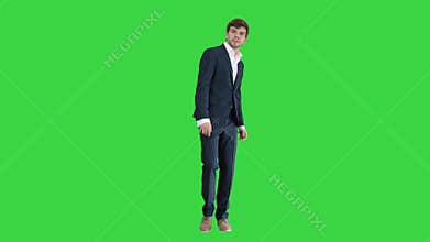 Dancing businessman in black suit on a Green Screen, Chroma Key.