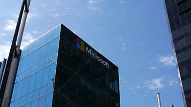 Motion of Microsoft corporate building against blue sky