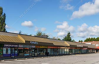 RICHMOND, CANADA - June 6, 2019: Strip mall or shopping plaza sunny summer day.