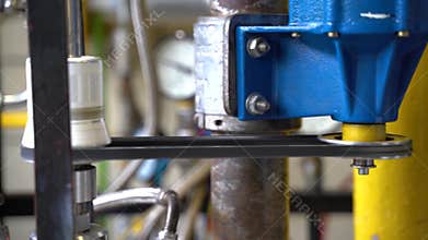 The engine rotates the shaft with a drive belt